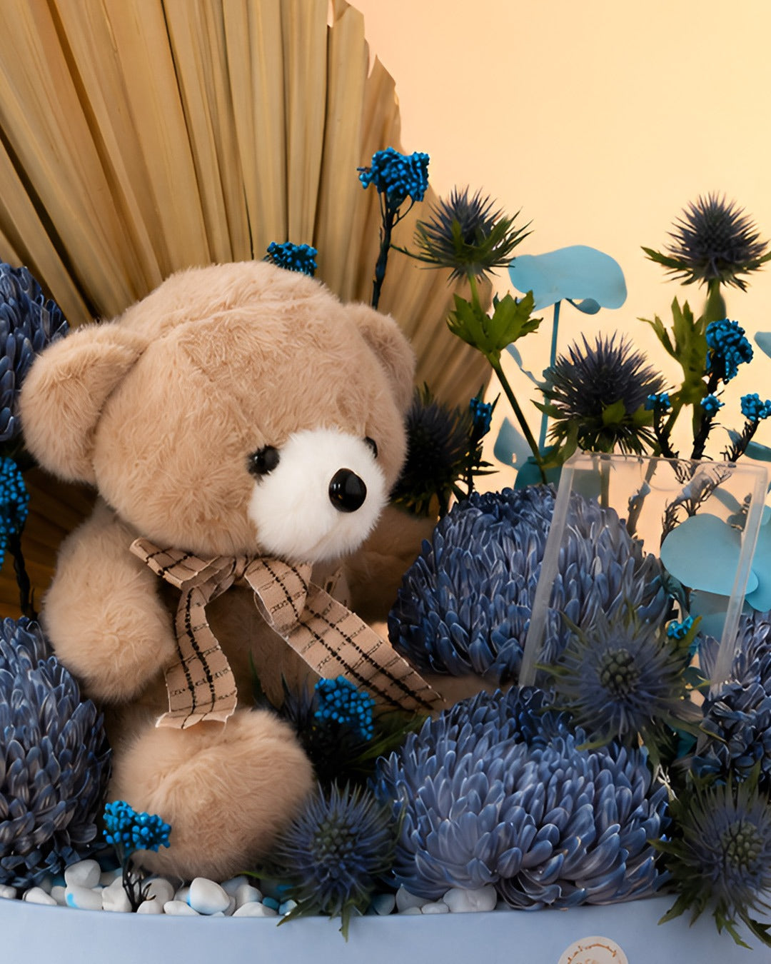 Blubell Cuddles new born baby gift with blue flowers and teddy bear from Whimsy Flowers Abu Dhabi.