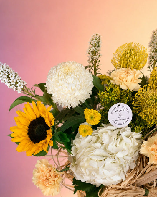 Countryside Charm flower basket arrangement with rustic mixed blooms in a woven basket from Whimsy Flowers Abu Dhabi.