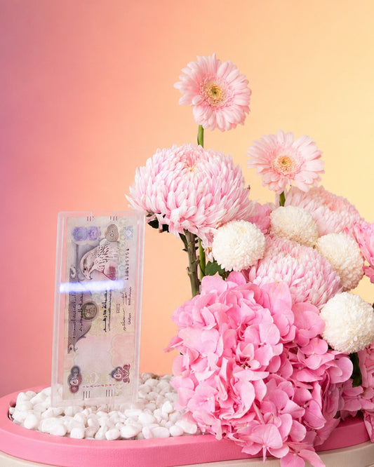 Princess Petal Garden new born baby flower arrangement with pink blooms in a stylish box from Whimsy Flowers Abu Dhabi.