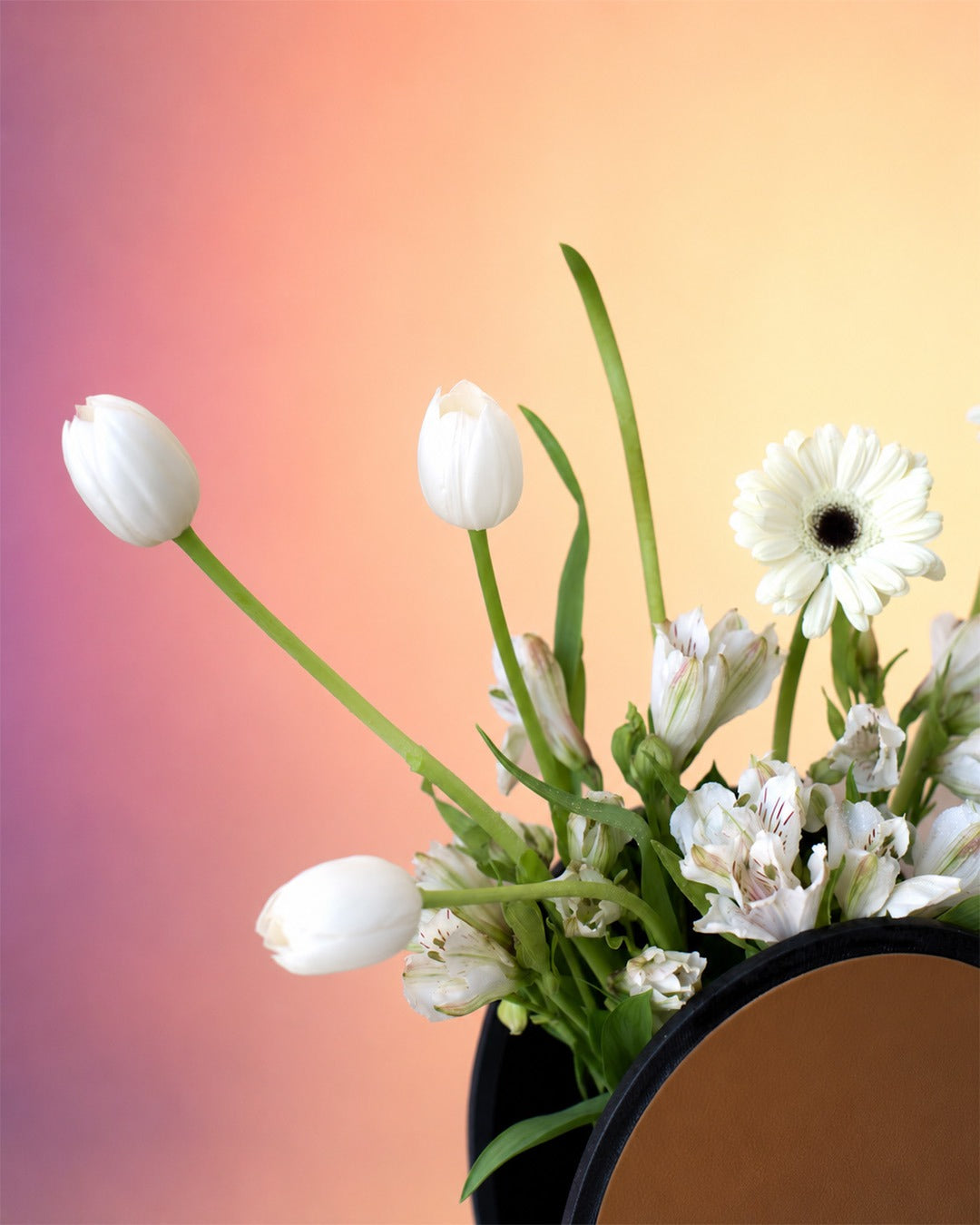 Scholar Bloom graduation flower vase arrangement with white blooms in a graduation cap vase from Whimsy Flowers Abu Dhabi.
