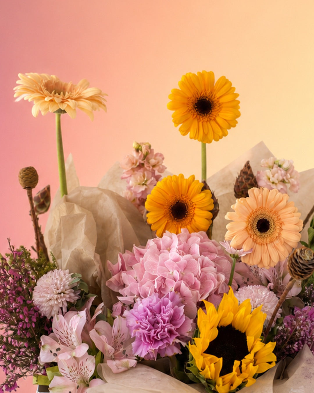 Morning Glow flower bag with sunflowers and warm yellow blooms in a stylish carry bag from Whimsy Flowers Abu Dhabi.