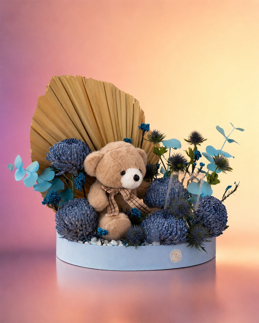 Blubell Cuddles new born baby gift with blue flowers and teddy bear from Whimsy Flowers Abu Dhabi.