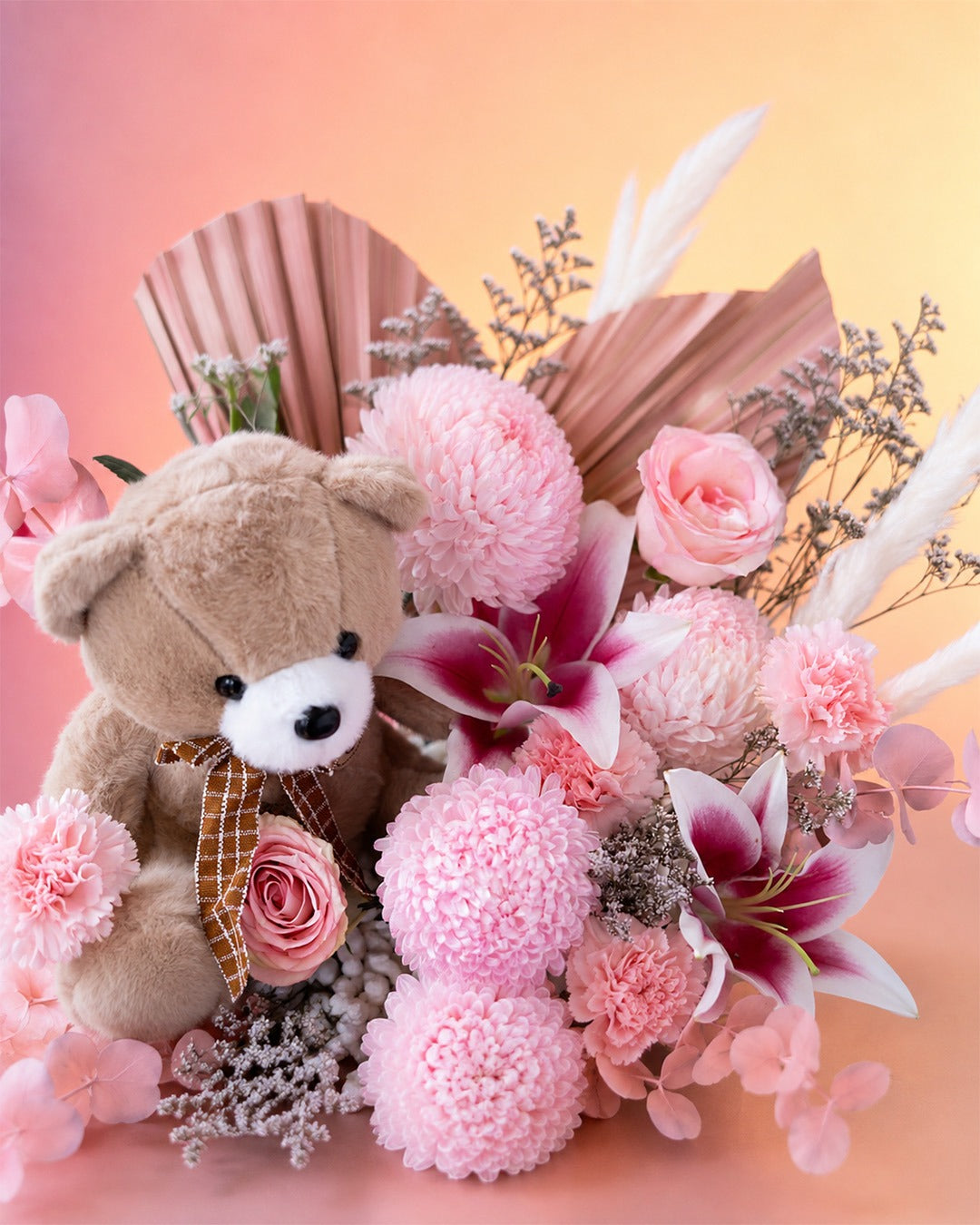 Blush Cuddles new born baby gift with pink flowers and teddy bear from Whimsy Flowers Abu Dhabi.