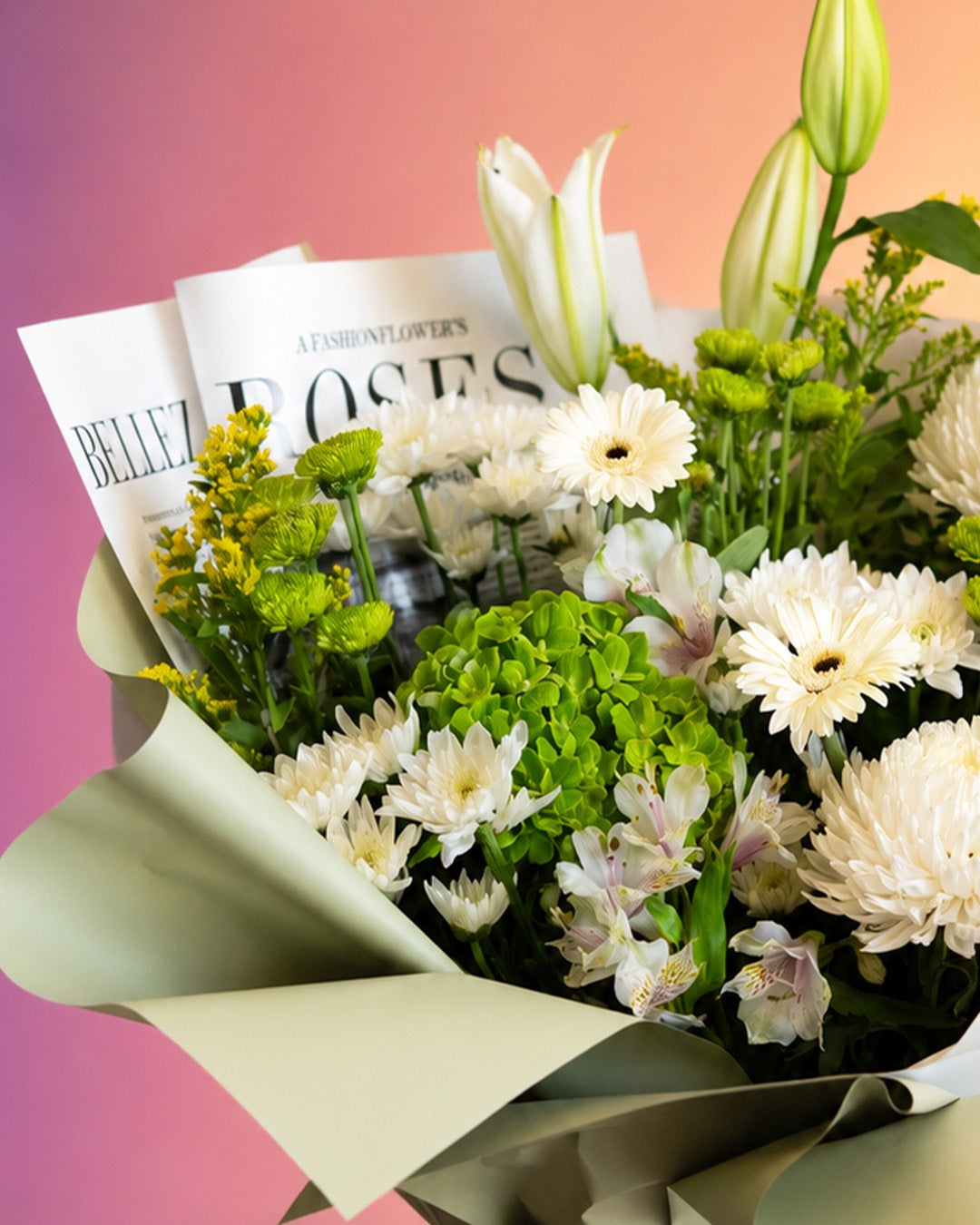 Botanical Bliss flower bouquet with fresh white and green garden blooms in soft wrap from Whimsy Flowers Abu Dhabi.