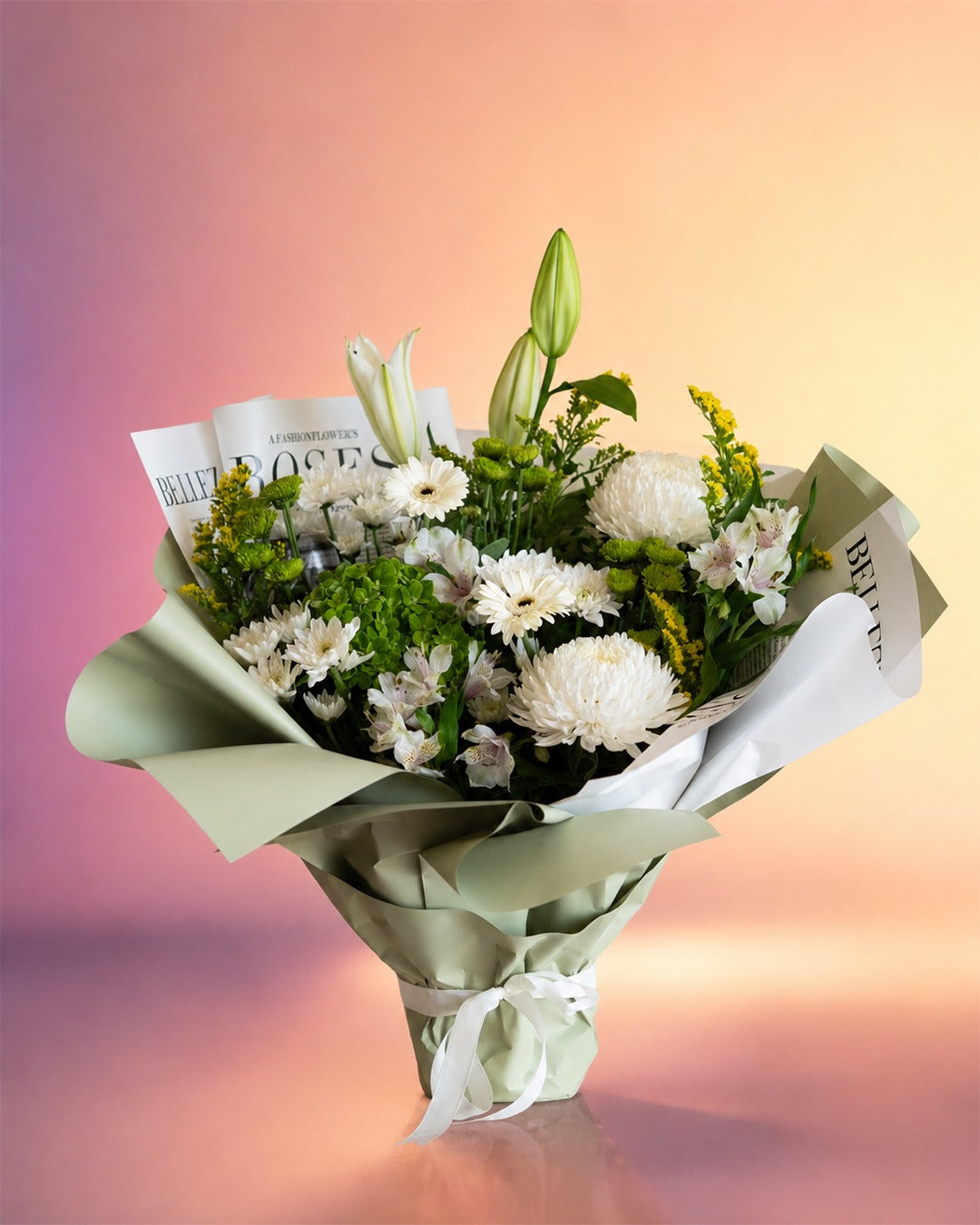 Botanical Bliss flower bouquet with fresh white and green garden blooms in soft wrap from Whimsy Flowers Abu Dhabi.