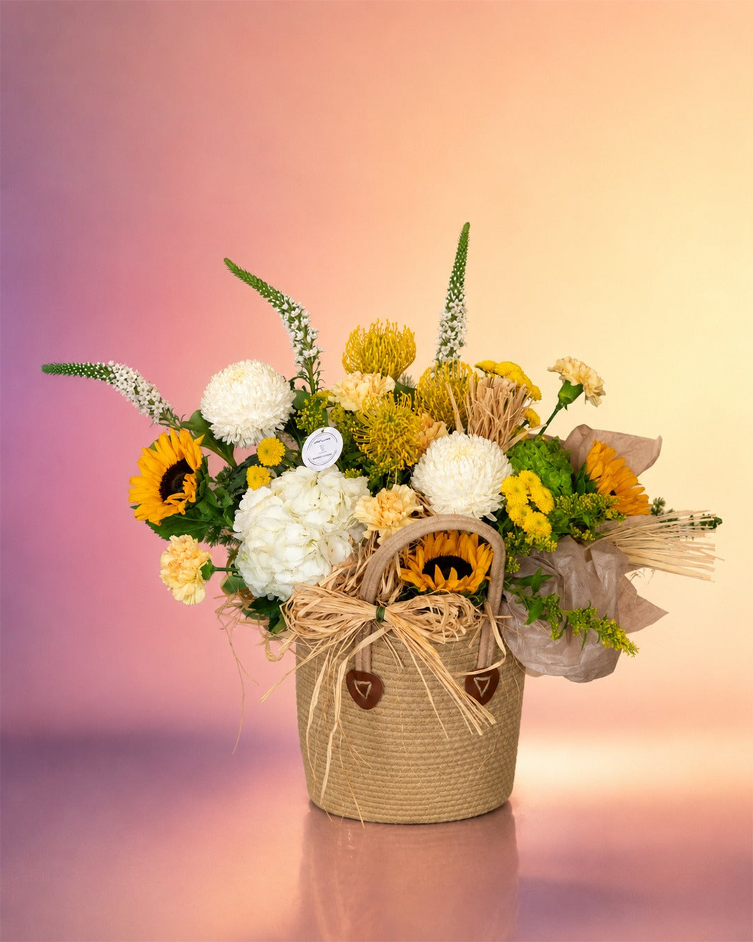 Countryside Charm flower basket arrangement with rustic mixed blooms in a woven basket from Whimsy Flowers Abu Dhabi.