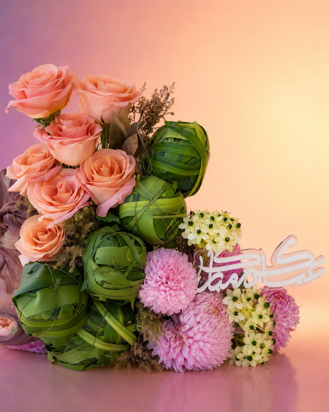Eid Blossom Symphony flower vase arrangement with pink and burgundy florals from Whimsy Flowers Abu Dhabi.