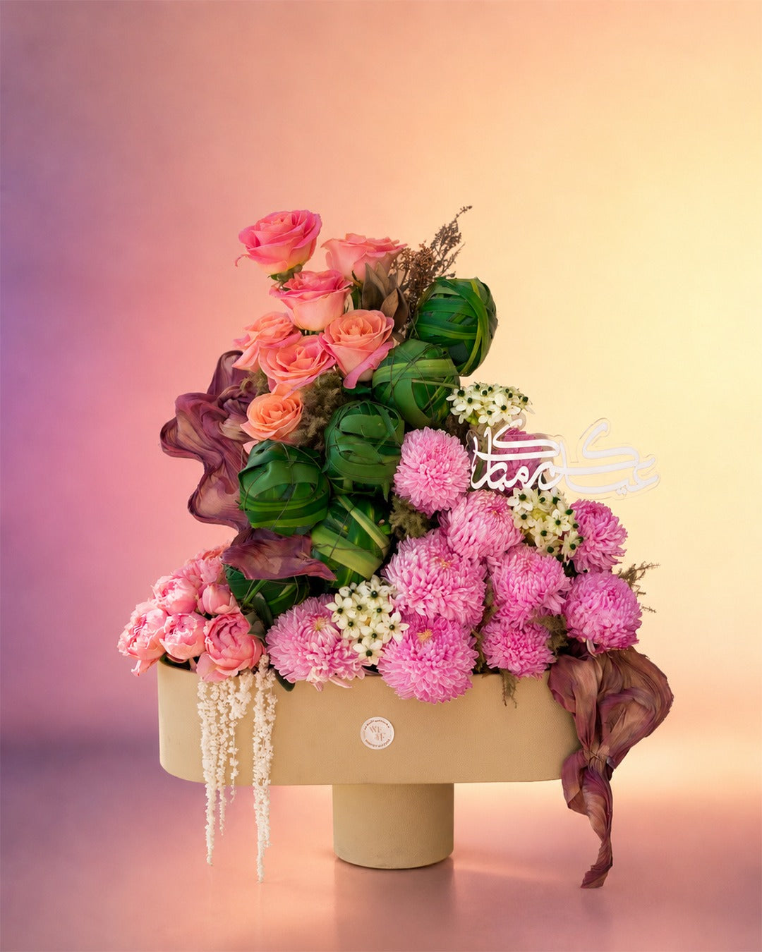Eid Blossom Symphony flower vase arrangement with pink and burgundy florals from Whimsy Flowers Abu Dhabi.