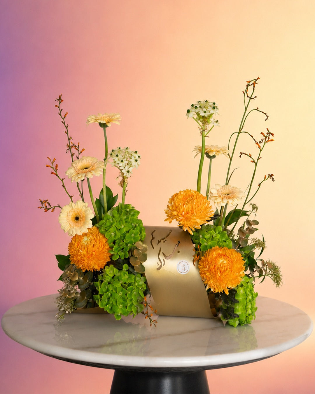 Golden Meadow flower tray arrangement with bright orange and wildflower blooms from Whimsy Flowers Abu Dhabi.