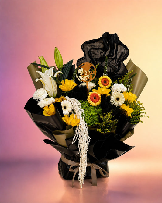 Graduation Glory flower bouquet with black roses and yellow blooms from Whimsy Flowers Abu Dhabi.