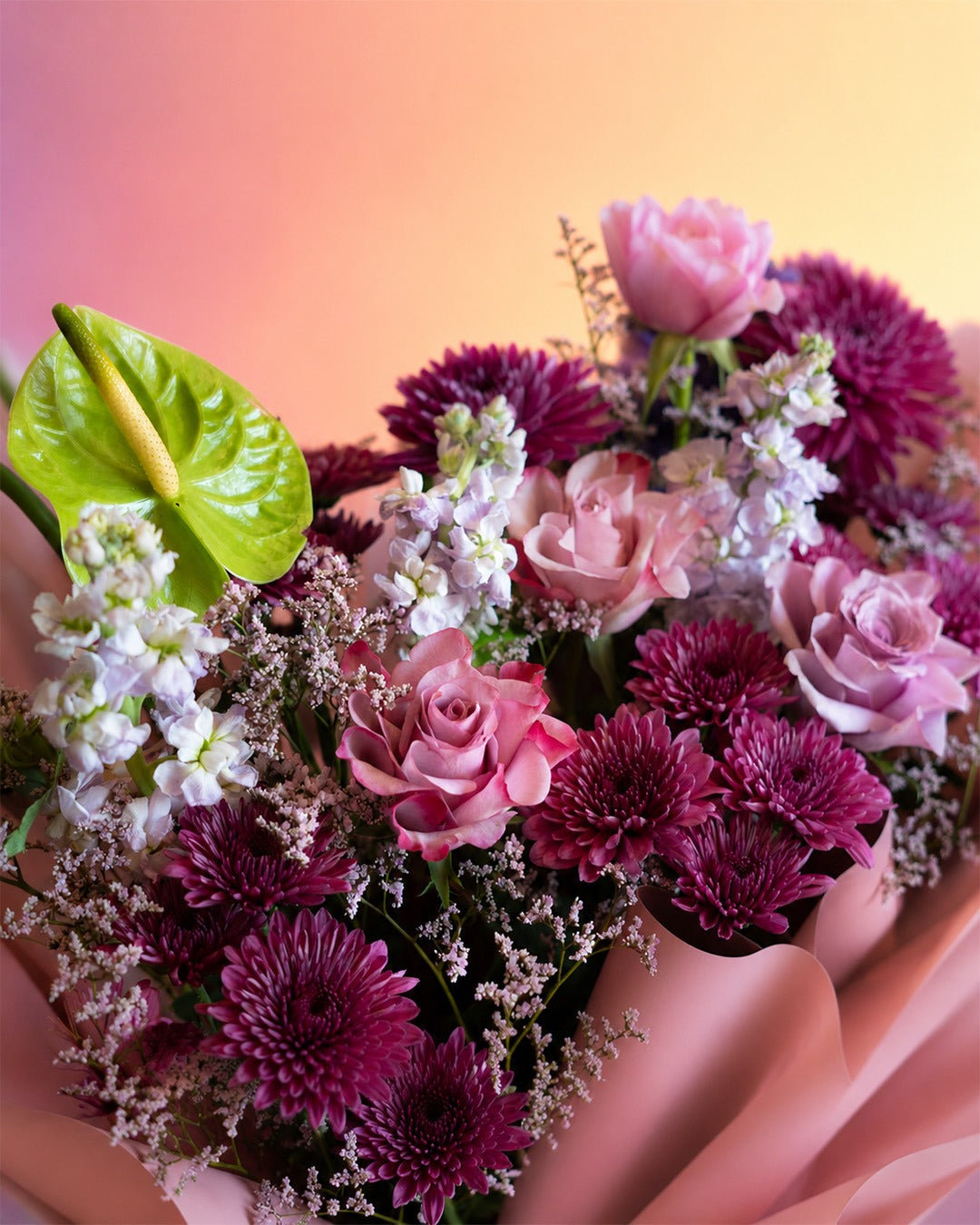 Lavender Kiss flower bouquet with lavender and pink blooms in soft wrap from Whimsy Flowers Abu Dhabi.