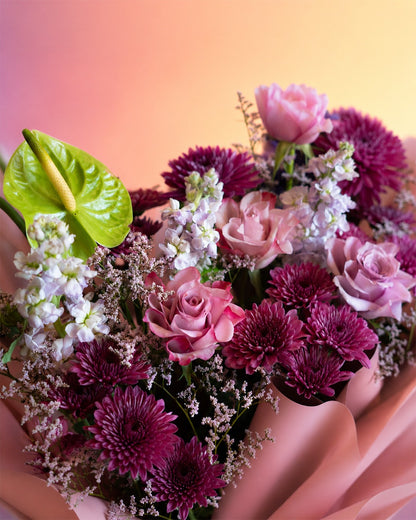 Lavender Kiss flower bouquet with lavender and pink blooms in soft wrap from Whimsy Flowers Abu Dhabi.