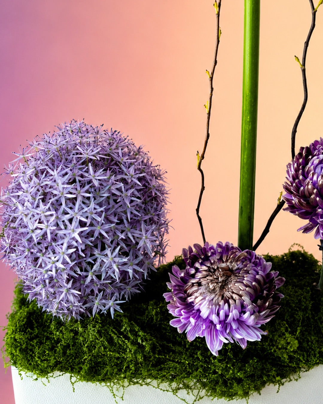 Lavender Muse flower vase arrangement with allium and lavender blooms in a modern vase from Whimsy Flowers Abu Dhabi.