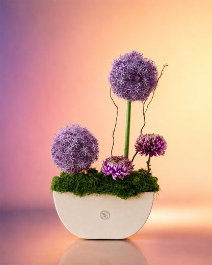 Lavender Muse flower vase arrangement with allium and lavender blooms in a modern vase from Whimsy Flowers Abu Dhabi.