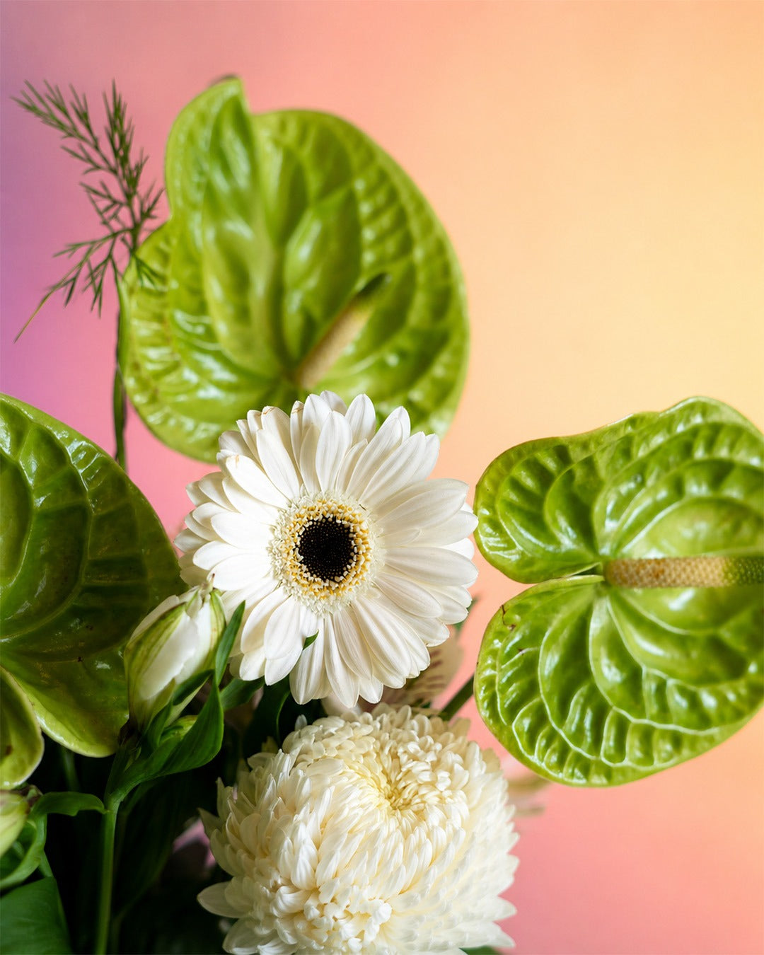 Lime Whisper flower vase arrangement with fresh green and white blooms in a white vase from Whimsy Flowers Abu Dhabi.