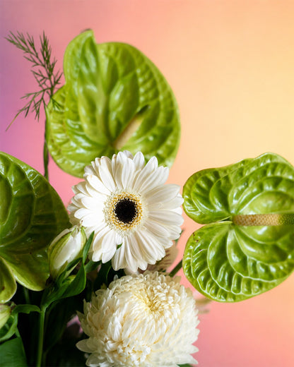 Lime Whisper flower vase arrangement with fresh green and white blooms in a white vase from Whimsy Flowers Abu Dhabi.