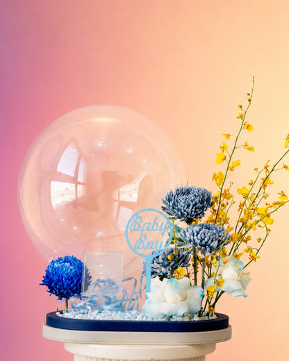 Little Prince new born baby flower bloom box with blue florals and balloon accent from Whimsy Flowers Abu Dhabi.