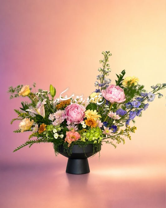 Maison de Fleur flower vase arrangement with pastel mixed blooms in a chic black vase from Whimsy Flowers Abu Dhabi.