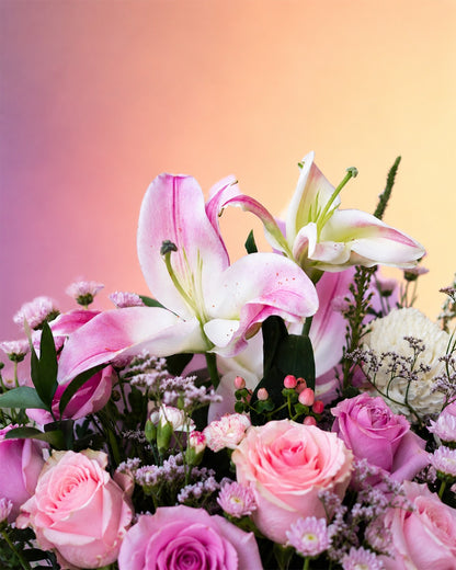 Pink Lily Elegance flower bouquet with pink lilies and roses in a stylish wrap from Whimsy Flowers Abu Dhabi.