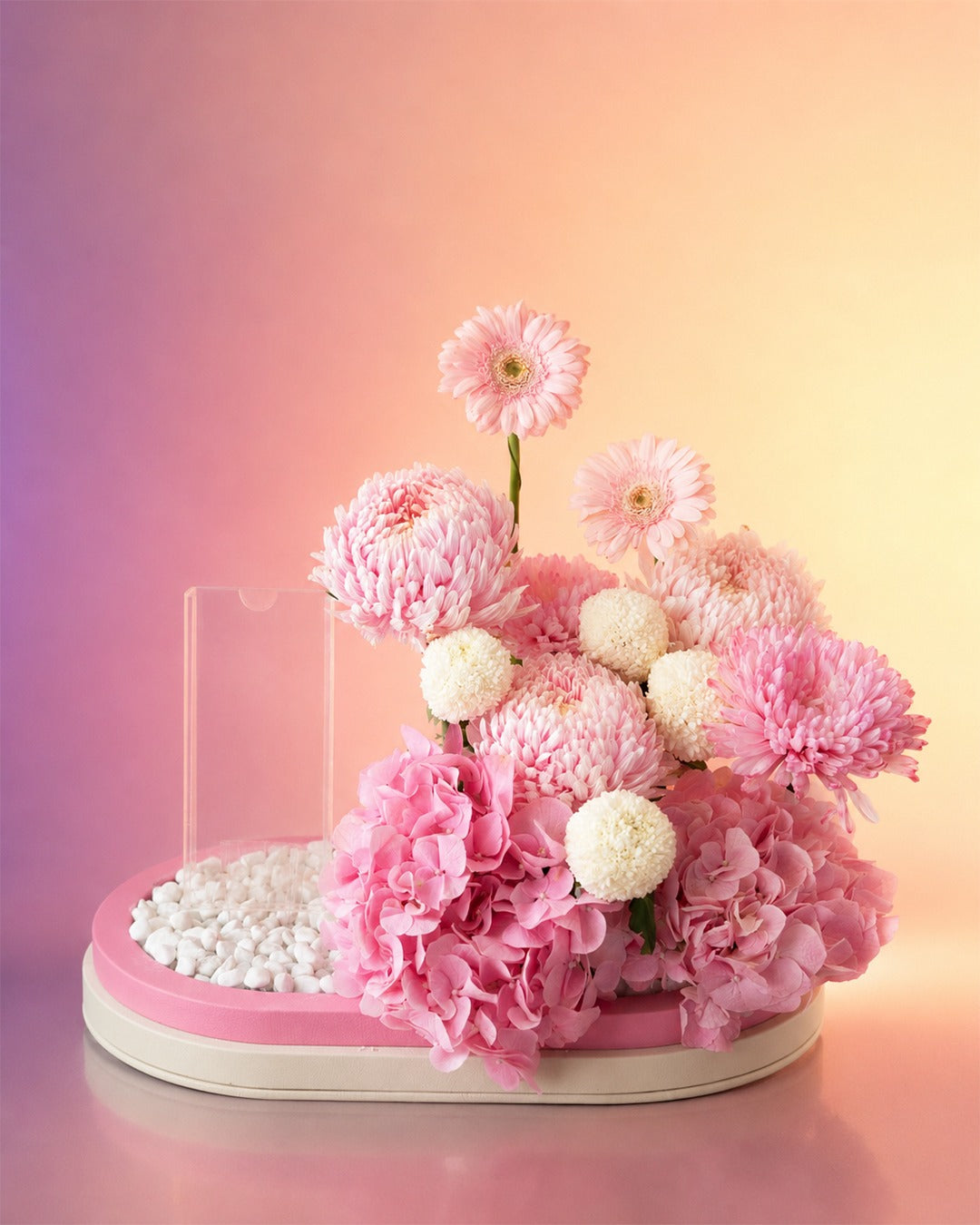 Princess Petal Garden new born baby flower arrangement with pink blooms in a stylish box from Whimsy Flowers Abu Dhabi.
