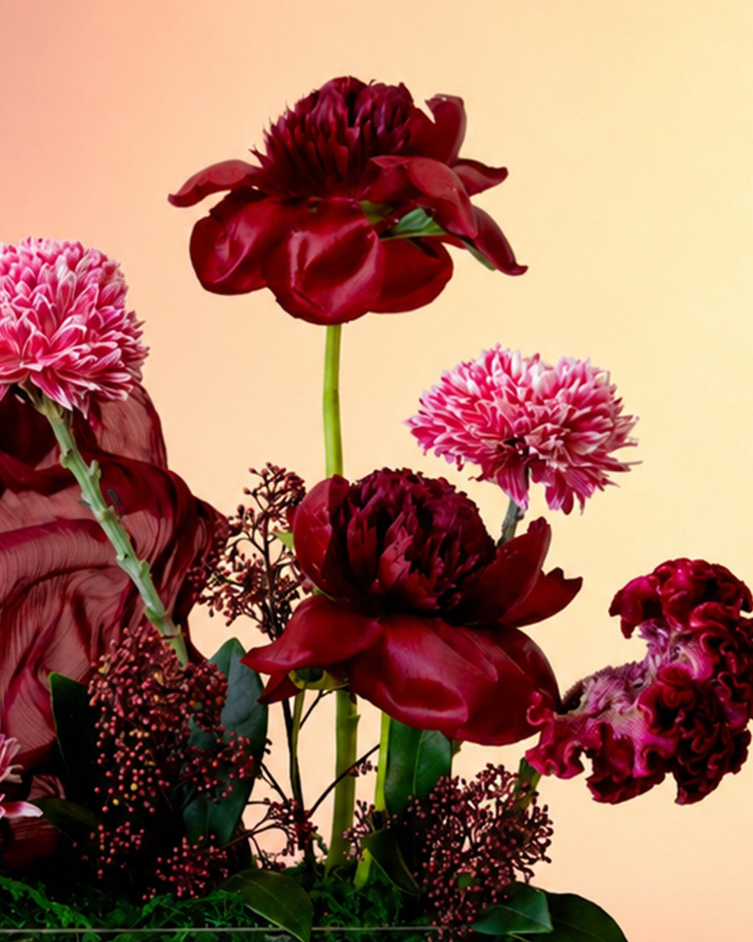 Velvet Bloom flower tray arrangement with luxe burgundy florals in an elegant tray from Whimsy Flowers Abu Dhabi.