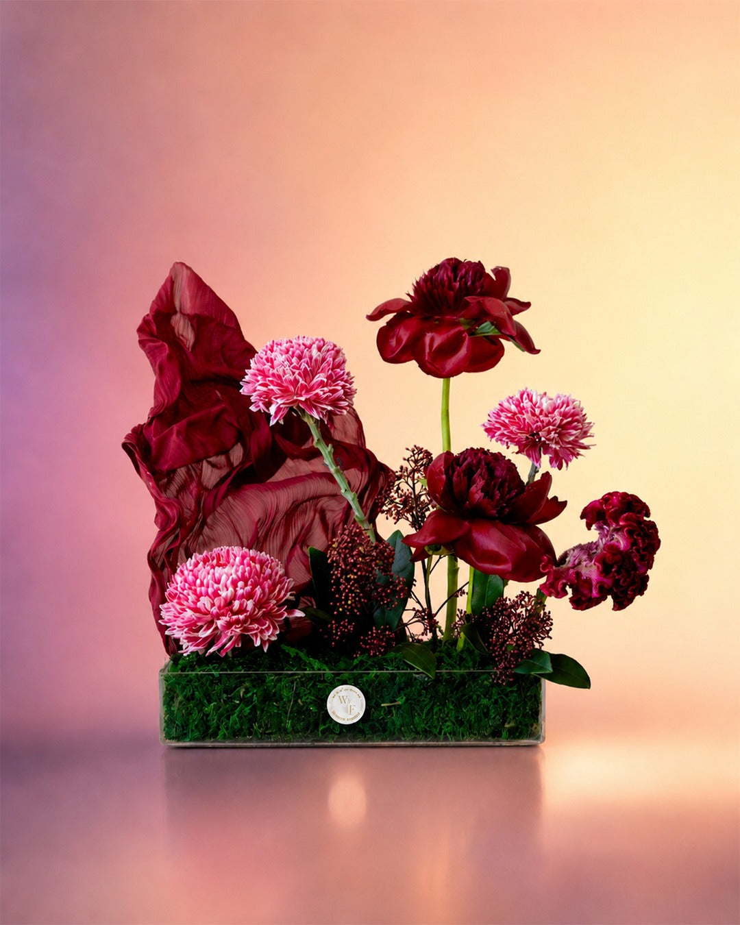 Velvet Bloom flower tray arrangement with luxe burgundy florals in an elegant tray from Whimsy Flowers Abu Dhabi.