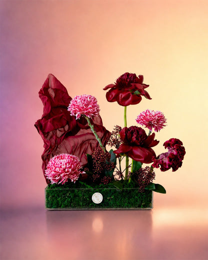 Velvet Bloom flower tray arrangement with luxe burgundy florals in an elegant tray from Whimsy Flowers Abu Dhabi.